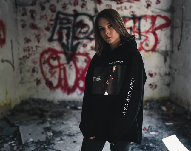 Original styling reference: the black hoodie in a graffiti interior